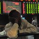 A broker in Pakistan watches the market meltdown. (Getty Images)